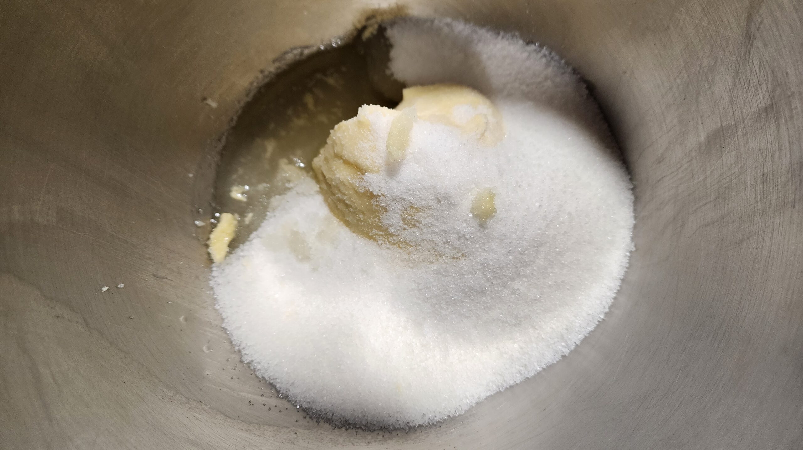 Butter, oil and sugar ready to be mixed in a steel bowl