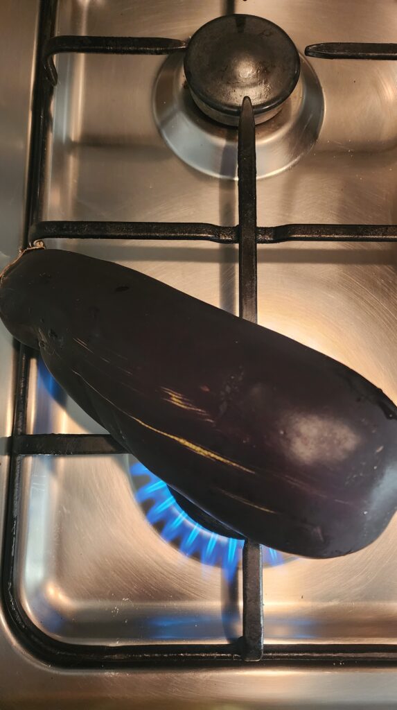 Eggplant/ aubergine being roasted for making Middle Eastern dip Mutabal