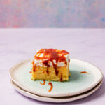 Tresleches cake piece with caramel drizzle