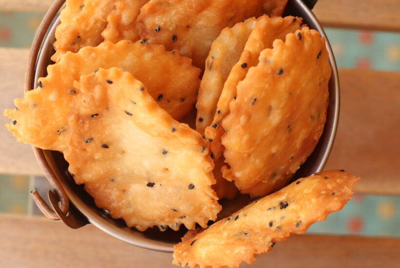 Top vide of papdi in a bucket for papri chaat