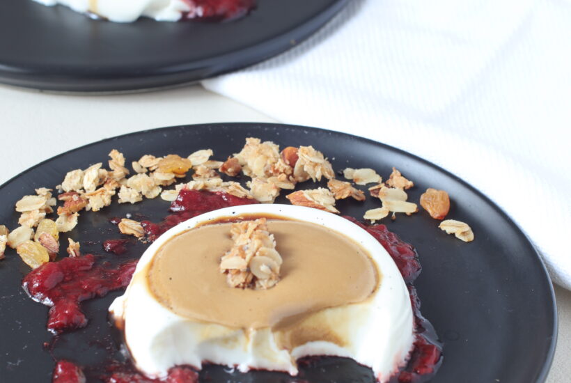 Vanilla panna cotta served with dalgona and strawberry compote and granola