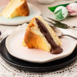 slice of san sebastian cheesecake with chocolate sauce